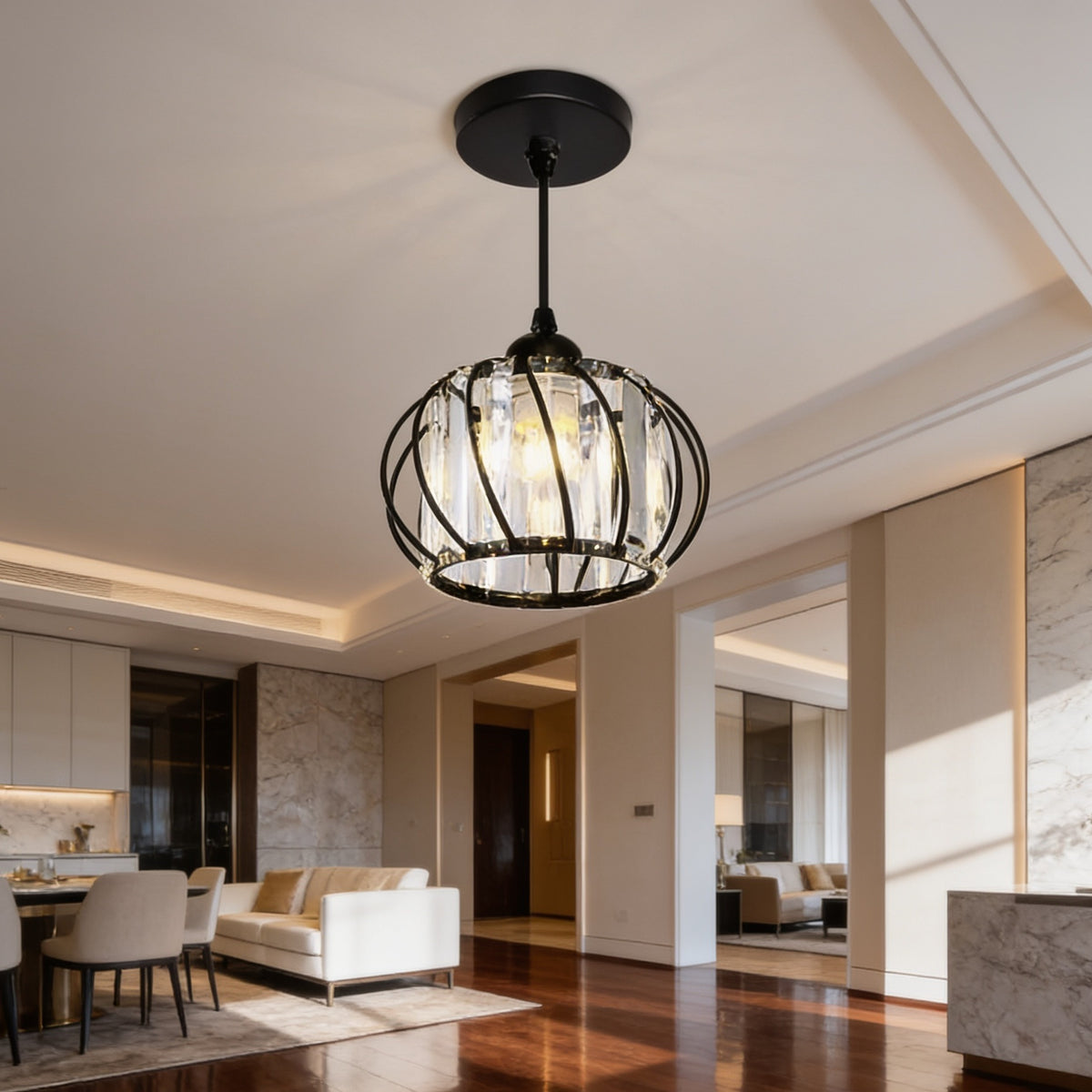 Black cage pendant on a short cord above an open living room with a sofa and dining chairs