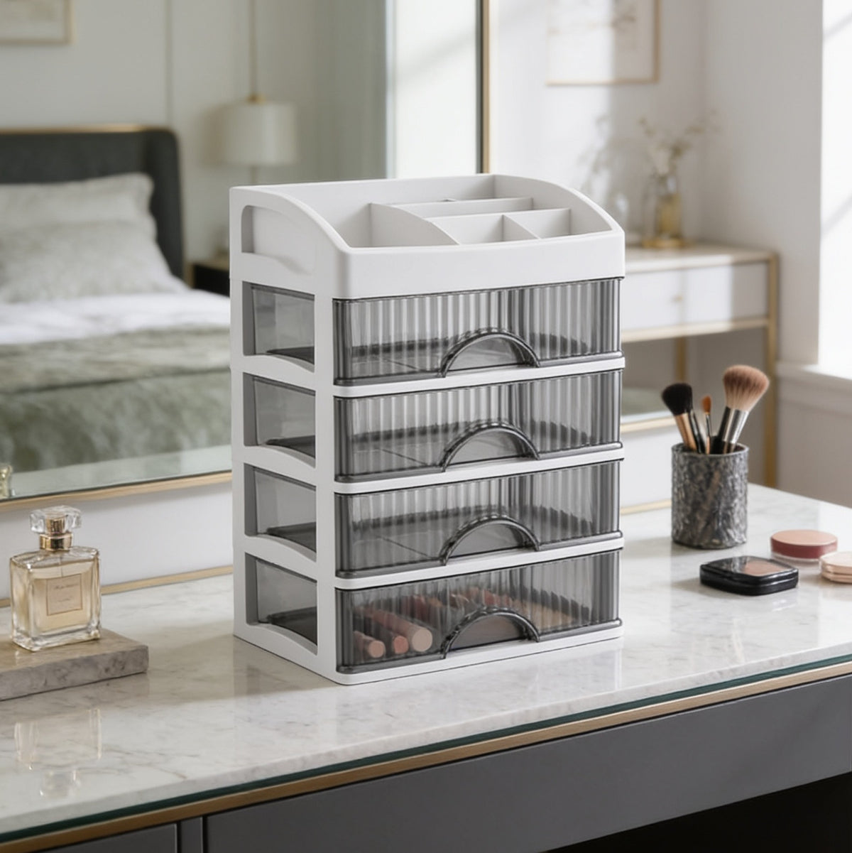 Cosmetic drawer tower on a dressing table below a round gold mirror