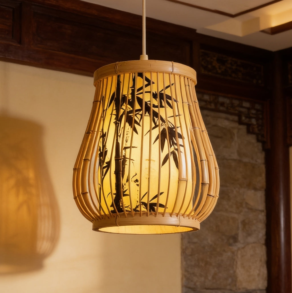 Gourd shaped bamboo shade painted with black bamboo leaves, lit beside a carved screen
