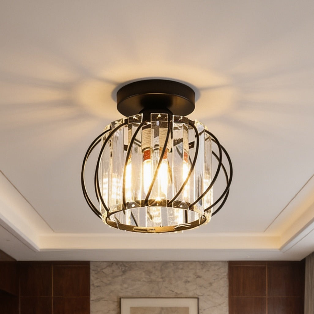 Crystal cage fixture on a stepped ceiling edge with warm light spilling across the plaster