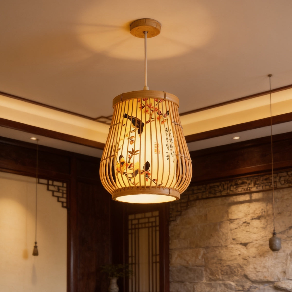 Tapered bamboo lantern hung on a slim cord, lit against stone blocks and a wood post