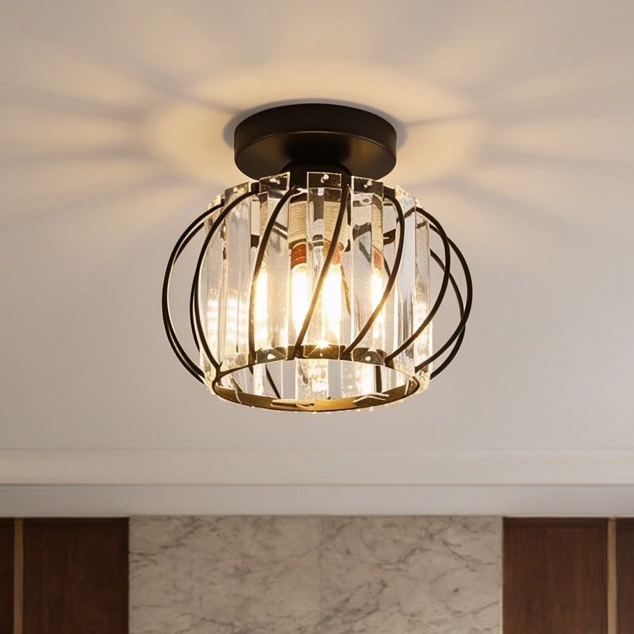 Flush mount crystal lantern glowing above a marble wall and dark wood paneling