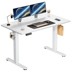 White top adjustable desk with a white frame on white, set up with two monitors and a headset hook