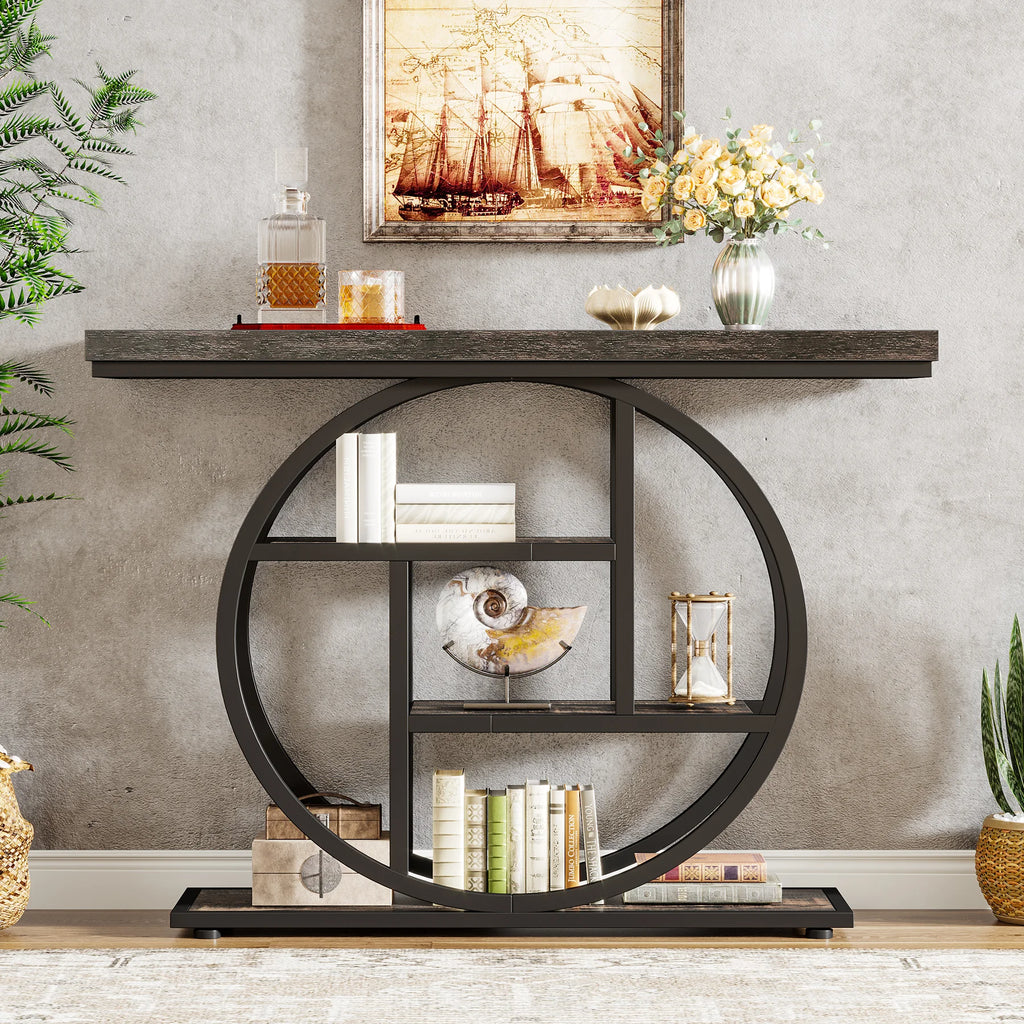 Weathered top console with black rings on a green wall below framed art