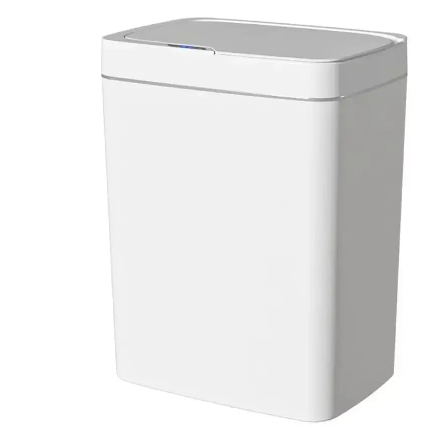 Plain studio view of the closed white sensor trash can on a white background