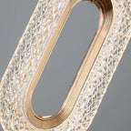Close view of the crystal filled gold oval ring and its faceted beads