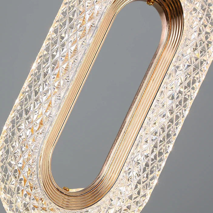 Close view of the crystal filled gold oval ring and its faceted beads