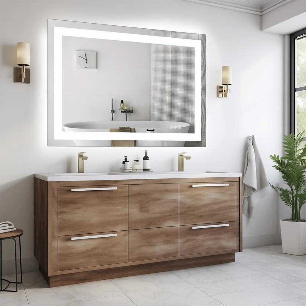 Backlit bathroom mirror between two wall sconces above a wood grain double vanity