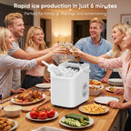 Ice machine set on a dining table as five people raise glasses over plates of party food