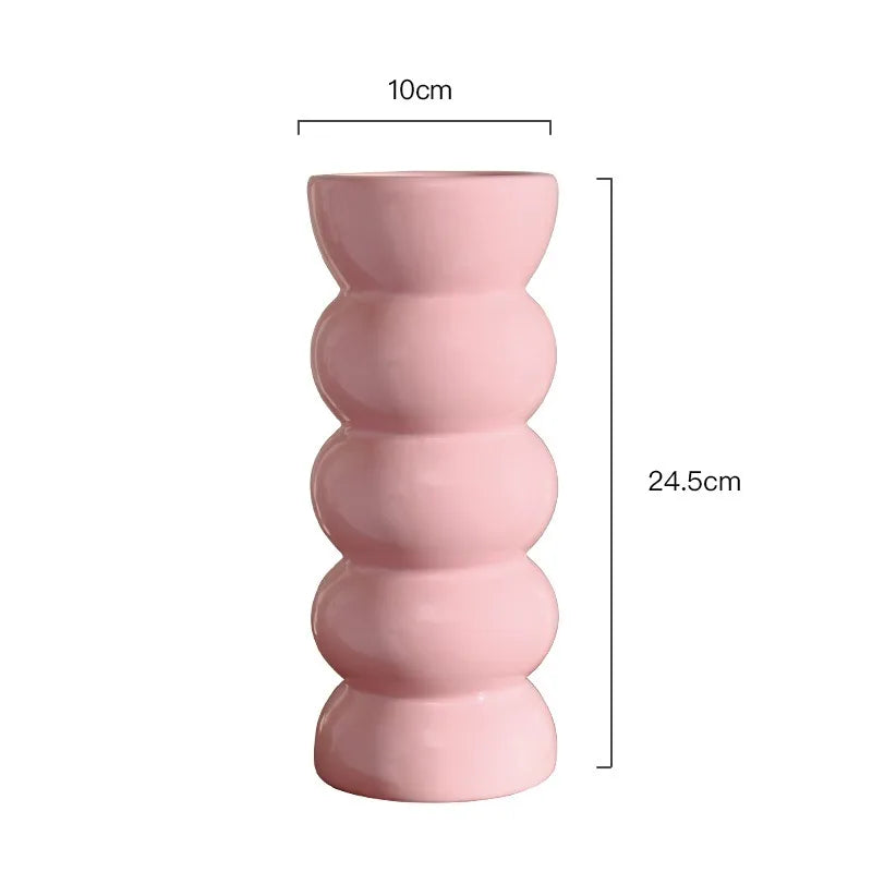 Dimension drawing of the pink ribbed vase with height and width marked