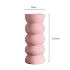 Dimension drawing of the pink ribbed vase with height and width marked