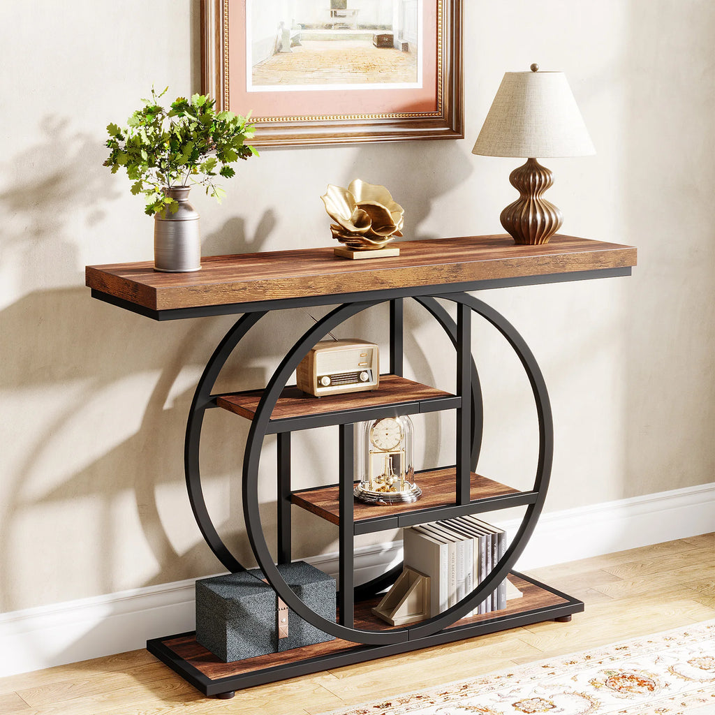 Wood topped console against a wall with a plant, lamp and baskets on lower shelves