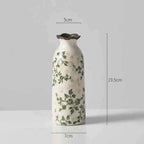 Middle height vine patterned vase on a plain gray background with size labels
