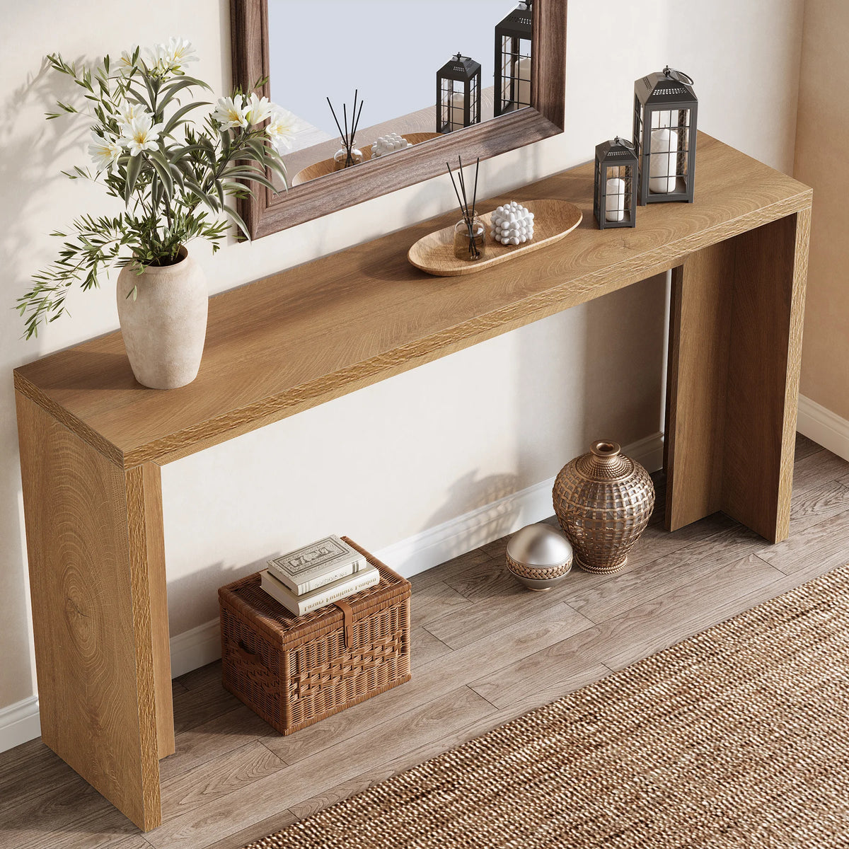 Angled view of the long wood console lined with lanterns and baskets below