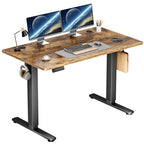 Rustic brown desktop on a black lift frame with two monitors and a keyboard on white