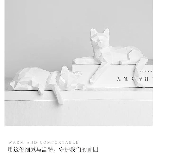 Two white cats on stacked books above a short printed caption line