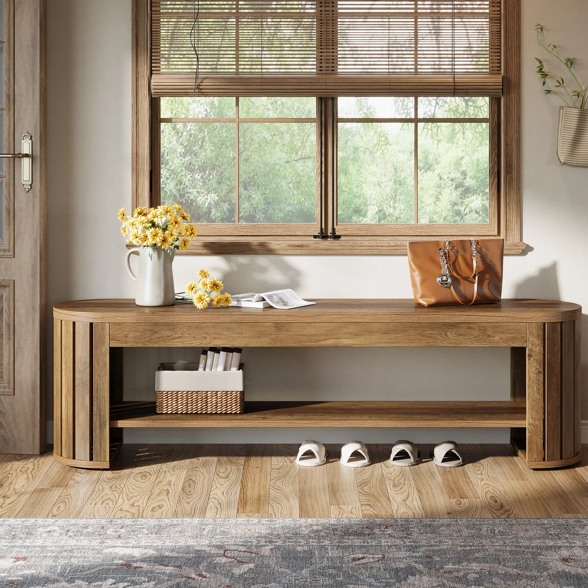 Entry bench under a window with a basket and shoes on the open lower shelf