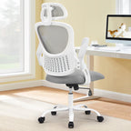 White frame chair with a gray mesh back beside a bright window and a white desk