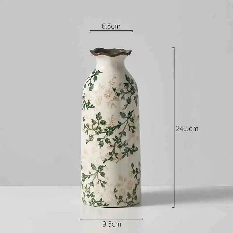 Tallest vine patterned vase on a plain gray background with size labels