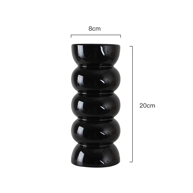 Dimension drawing of the black ribbed vase on a white background