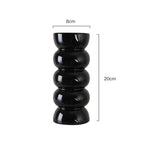 Dimension drawing of the black ribbed vase on a white background