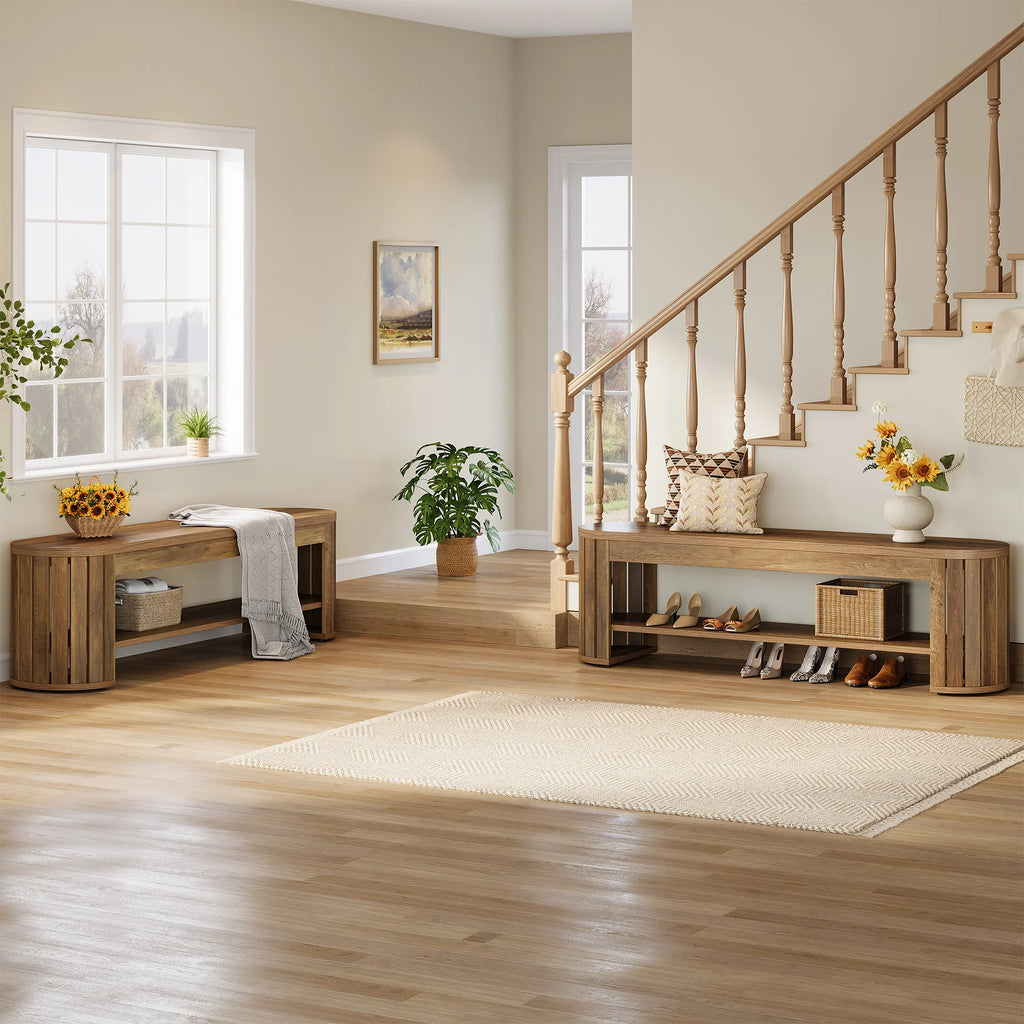Wide hallway view with the bench beside a staircase and a runner rug