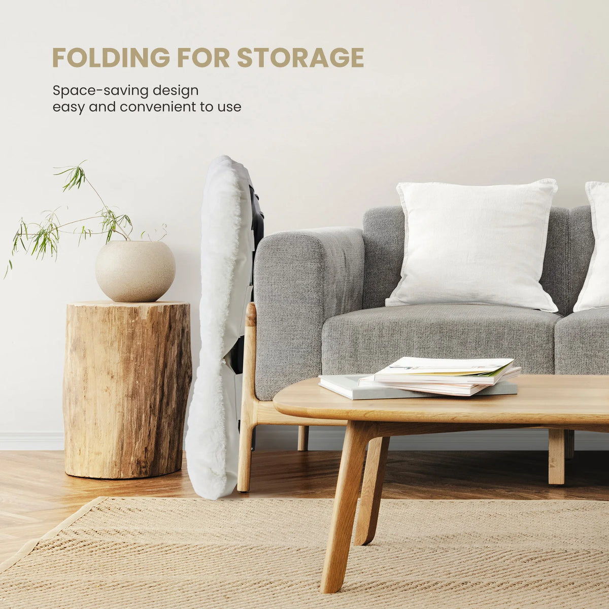 Folded saucer chair standing slim beside a sofa to show how it stores in a living room