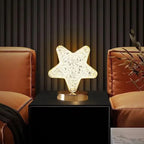 Star shaped crystal lamp lit on a black plinth against a dark paneled wall