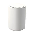 Studio view of the white sensor trash can with its rounded lid closed