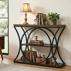 Corner console with a lamp and plant above stacked books on its lower shelf