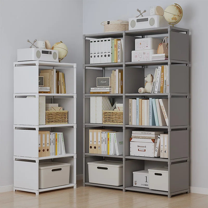 White and gray shelving units side by side holding books, boxes and a globe