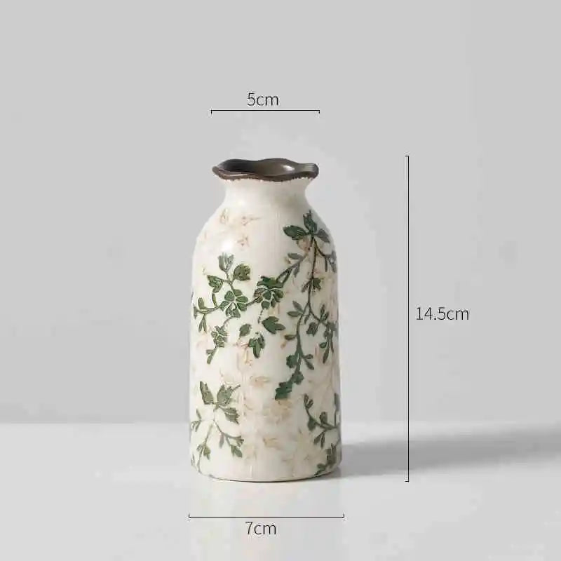 Shortest vine patterned vase on a plain gray background with size labels