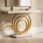 Gold ring console centered on a paneled entry wall below a rectangular mirror