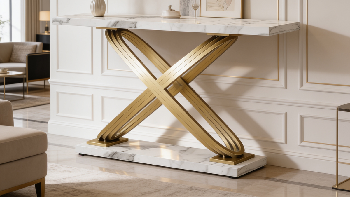 Close view of the gold X base and thick faux marble top of the console table