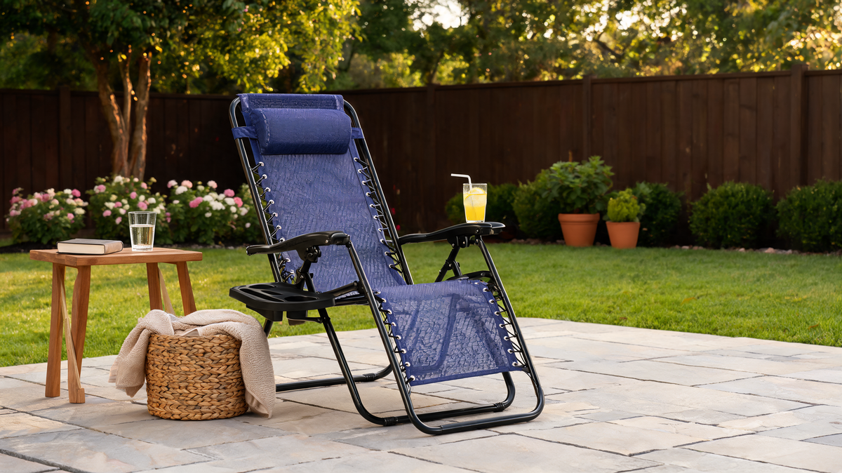 Folding zero gravity lounge chair locked at a reclined angle on a patio