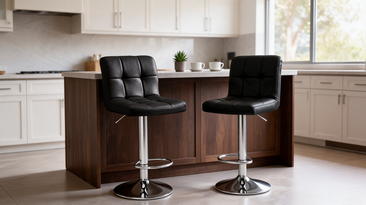 Two black PU leather bar stools tucked under a wood kitchen island