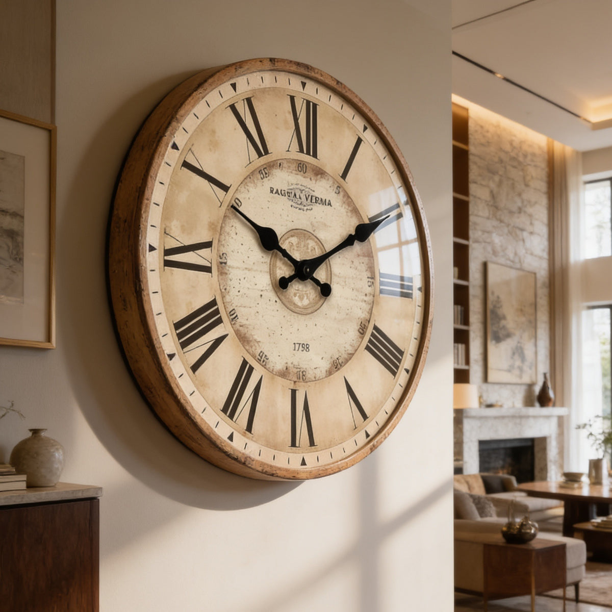 Round roman numeral clock on a living room wall near framed art and a fireplace