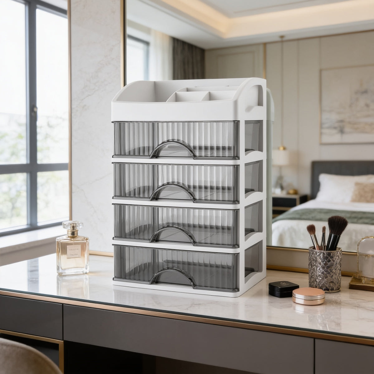 Clear drawer tower on a dark vanity with daylight from a window and a bed behind