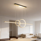 Gold ring and bar LED pendant lit above an open plan dining and living space