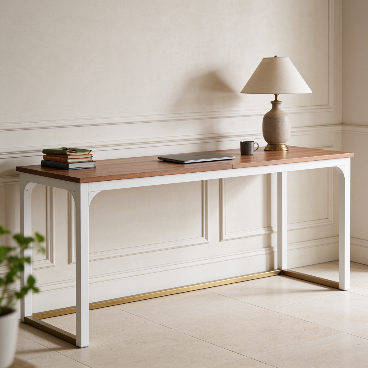 Wood top desk with white legs viewed from the left with a lamp and books