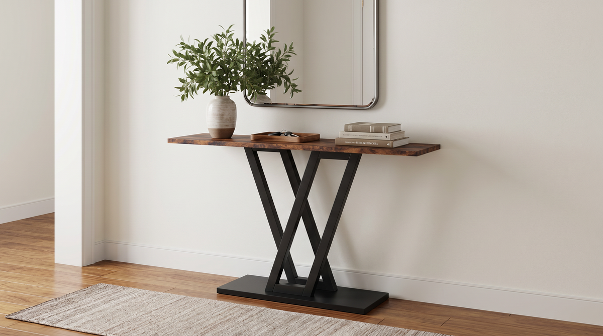 V base console table in an entryway below a framed mirror