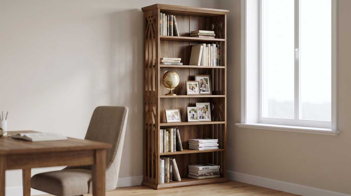 Six tier bookcase filled with books beside a desk and window