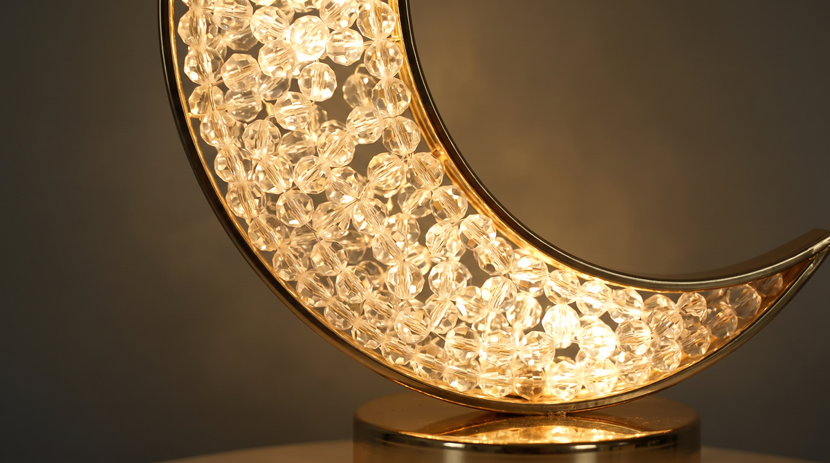 Close detail of the faceted beads inside the gold crescent frame