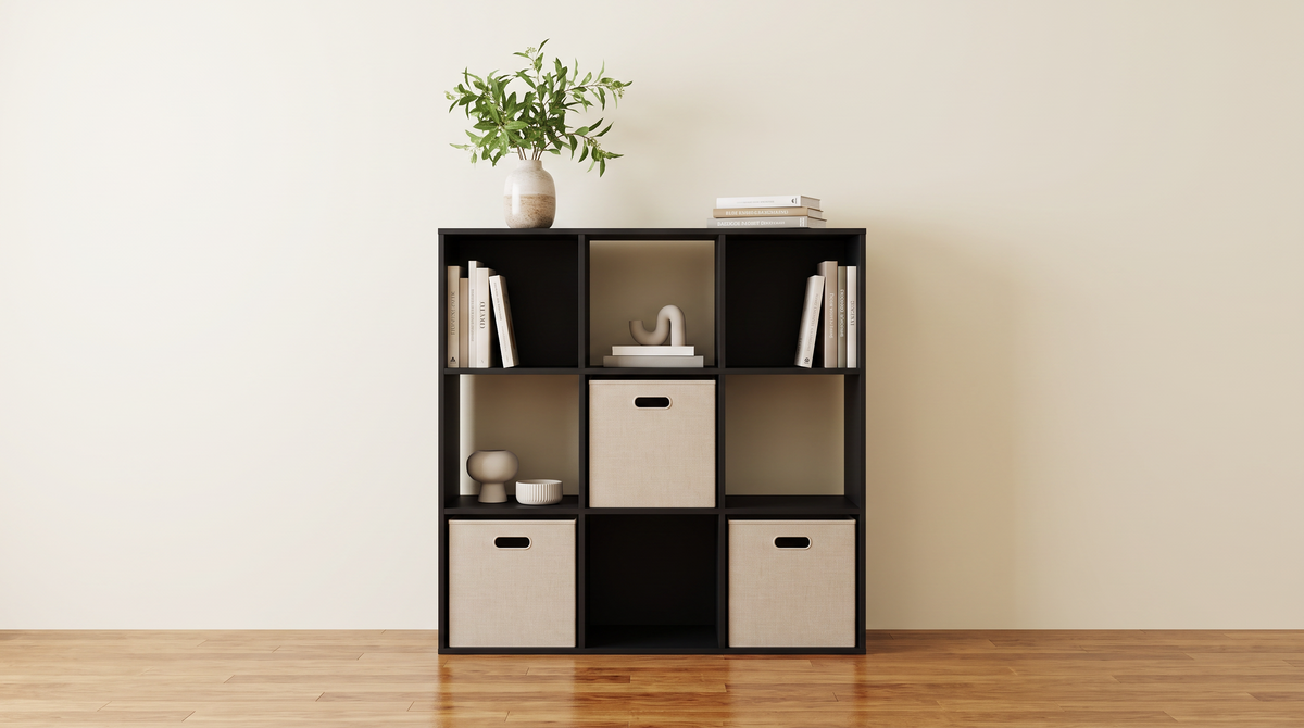 Black nine cube unit with some cubes open and others closed off with fabric bins