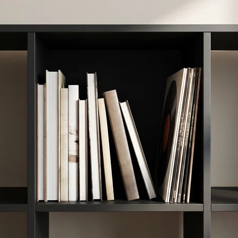 Close view of one cube packed with upright books and notebooks