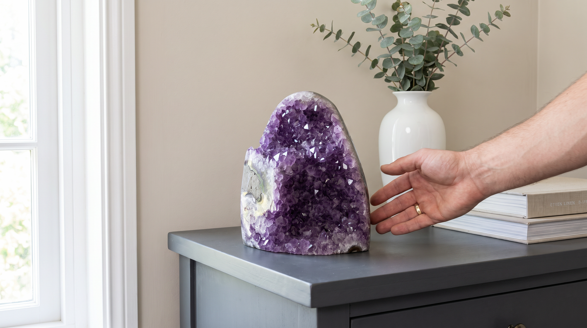 Large amethyst cluster anchoring a console table