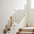Hexagon mirror tiles set in a diagonal band up a stairway wall
