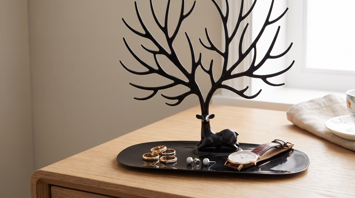 Oval tray at the base of the jewellery stand holding rings