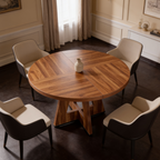 Round dining table with a patterned wood top beside curtains and a bright window