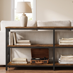 Three tier console table behind a sofa with two bays on every shelf